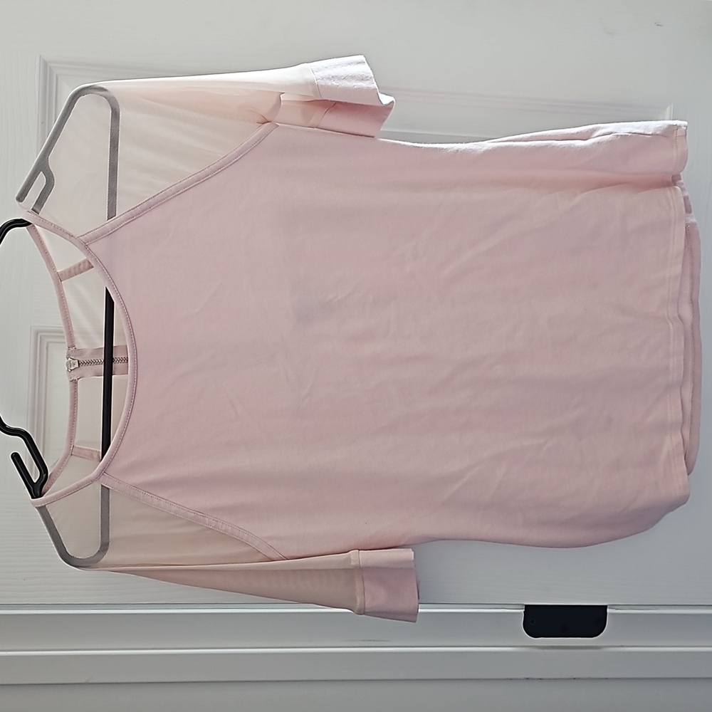 Pink shirt with mesh sleeves and upper back